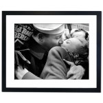 A sailor kisses girl in Times Square after the Nazi surrender Framed Print