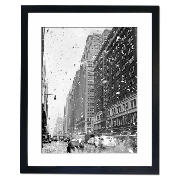 Bits of paper rain down on the street in Manhattan as rumours of Japan's surrender surface, 1945 Framed Print