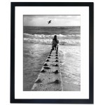 Sitting by the breakwater and watching the sun set up along the coast, over San Francisco Framed Print