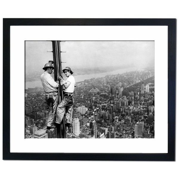 The Empire State Building receiving a new antenna Framed Print