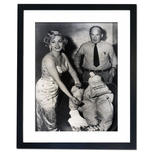 Zsa Zsa Gabor counts out her first week's salary of 6,000 dollars, 1953 Framed Print